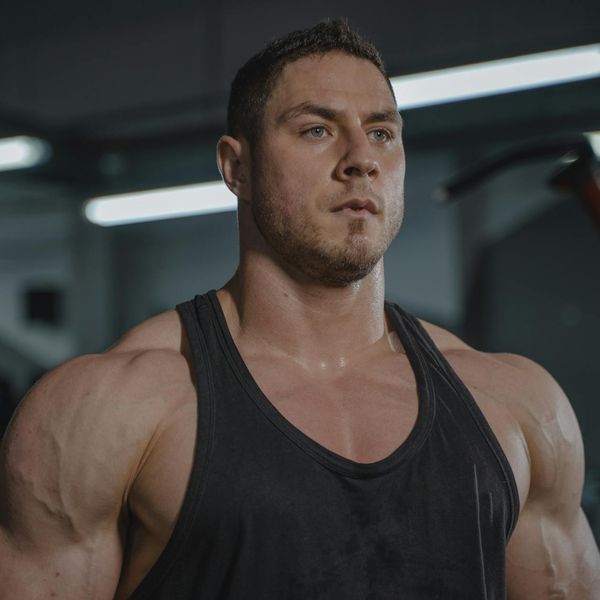 Athlete looking determined during a workout session in a gym.